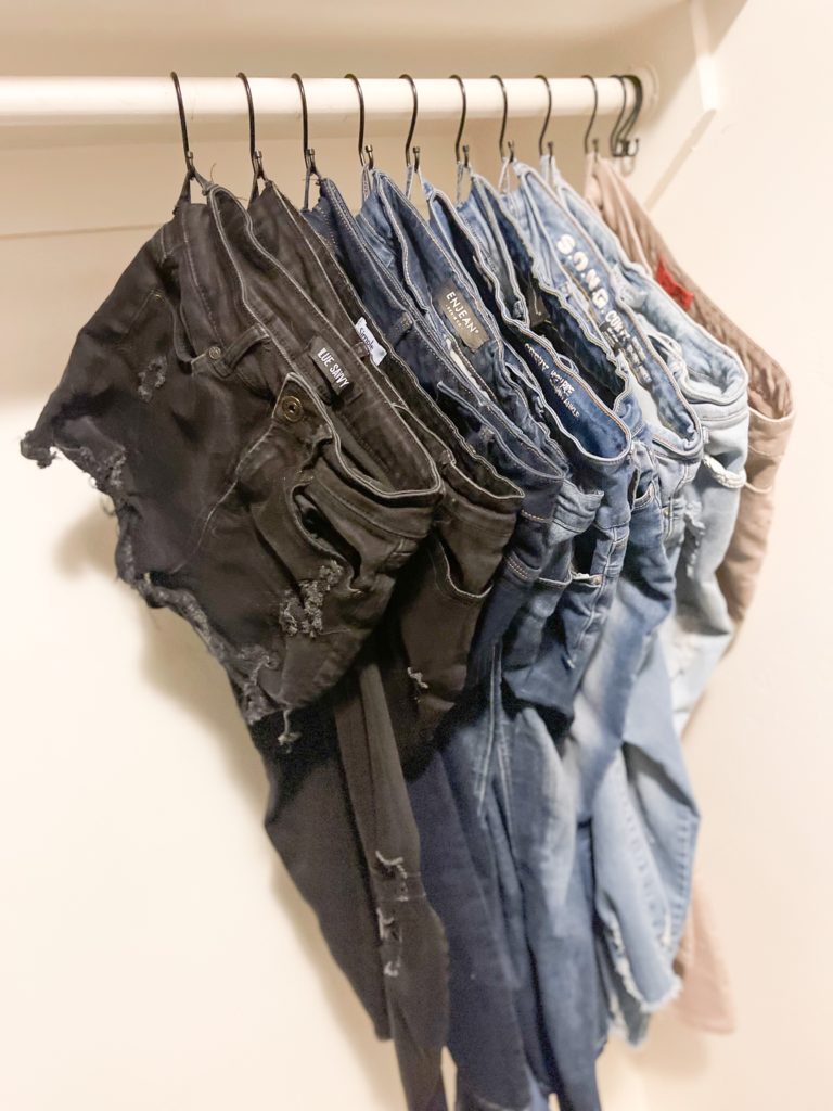 closet hack for hanging jeans, pants and shorts using shower curtain hooks